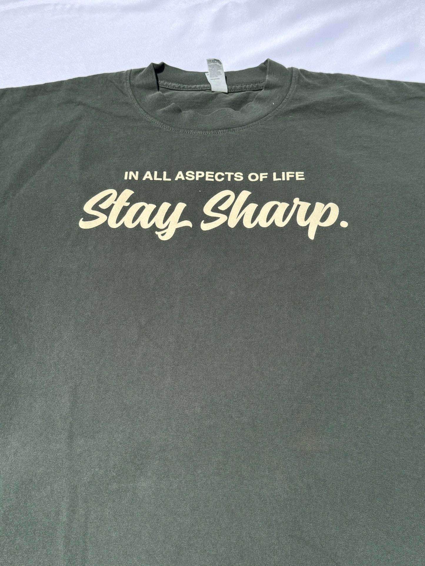 “In all aspects of life” Ivory Green T-Shirt